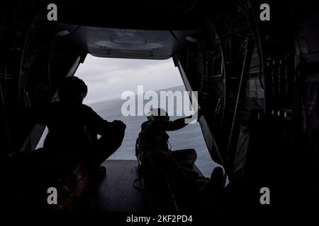 U.S. Marines with Marine Medium Tiltrotor Squadron (VMM) 265 scan the horizon during exercise Keen Sword 23 off the coast Kumamoto, Japan, Nov. 14, 2022.  Keen Sword exercises the combined capabilities and lethality developed between the 1st Marine Aircraft Wing, III Marine Expeditionary Force, and the Japan Self Defense Force (JSDF). This bilateral field-training exercise between the U.S. military and JSDF strengthens interoperability and combat readiness of the U.S.-Japan Alliance. (U.S. Marine Corps photo by Pfc. Justin J. Marty) Stock Photo