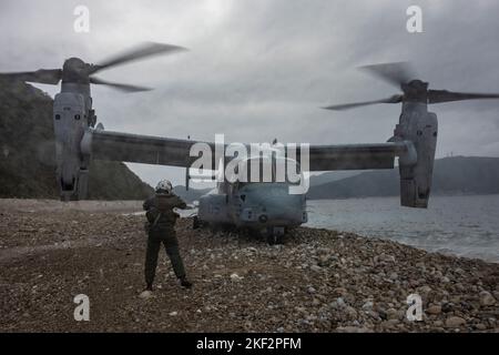 A U.S. Marine Corps MV-22B Osprey assigned to Marine Medium Tiltrotor Squadron (VMM) 265 lands during exercise Keen Sword 23 at Tutsara Island, Kumamoto, Japan, Nov. 14, 2022.  Keen Sword exercises the combined capabilities and lethality developed between the 1st Marine Aircraft Wing, III Marine Expeditionary Force, and the Japan Self Defense Force (JSDF). This bilateral field-training exercise between the U.S. military and JSDF strengthens interoperability and combat readiness of the U.S.-Japan Alliance. (U.S. Marine Corps photo by Pfc. Justin J. Marty) Stock Photo