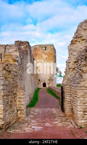 The old stone Izborskaya Church. The defensive corridor of the fortress walls, an architectural monument of the XIV-XVII centuries. Izborsk, Pskov reg Stock Photo