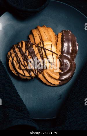 Viennese whirls are a British biscuit consisting of soft shortbread biscuits piped into a whirl shape, said to be inspired by Austrian pastries, which Stock Photo