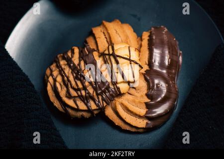 Viennese whirls are a British biscuit consisting of soft shortbread biscuits piped into a whirl shape, said to be inspired by Austrian pastries, which Stock Photo