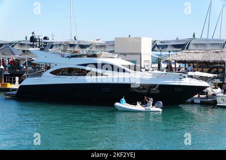 Cabo San Lucas, Mexico - November 7, 2022 - The luxury black and white boat by the bay Stock Photo