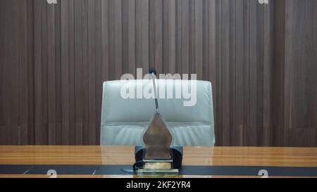 Interior table, chairs and microphone with coffee in the meeting room or work office Stock Photo