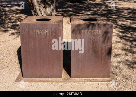 simple rusty metal trash and recycle bins in a southwest United States desert environment Stock Photo