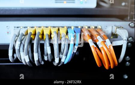 Server room, computer and cable for internet connection, cloud computing and cyber security. Hardware, wire and cord on equipment in a data center for Stock Photo