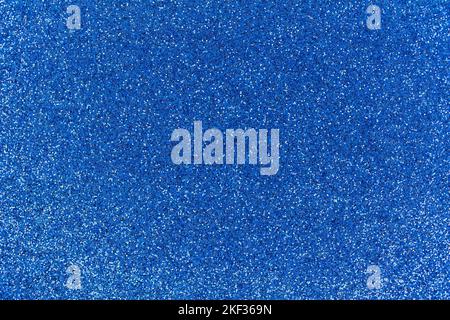 Full frame macro image of a deep blue color sparkling glitter texture background Stock Photo