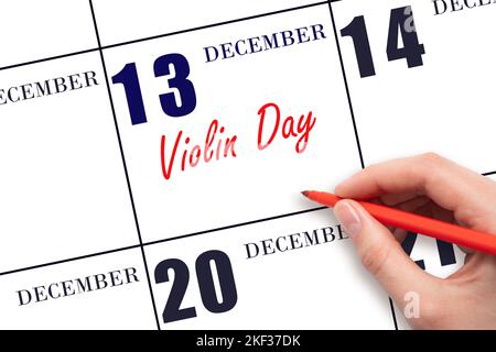 December 13. Hand writing text Violin Day on calendar date. Save the date. Day of the year concept. Stock Photo