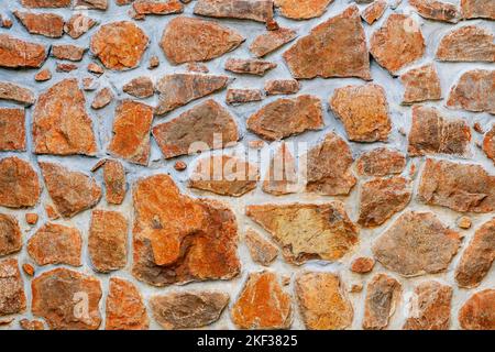 Stone wall, Texture of a stone wall. Stone wall texture background, rock wall. Stock Photo
