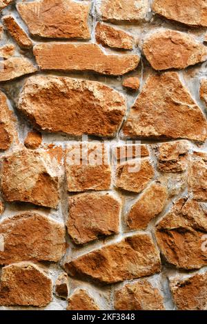 Stone wall, Texture of a stone wall. Stone wall texture background, rock wall. Stock Photo