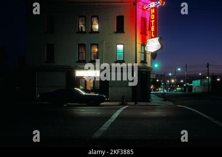 A 1971 Roadrunner car parked in front of The King Edward Hotel (King Eddy) at night. Calgary Alberta Canada. Circa 1985 Stock Photo