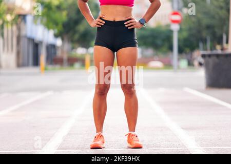 legs of a sportswoman in running clothes Stock Photo