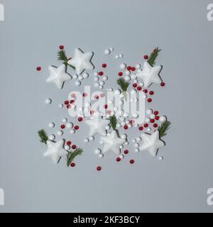 Creative layout made of white stars and other christmas decorations. Minimal flat lay concept. Stock Photo