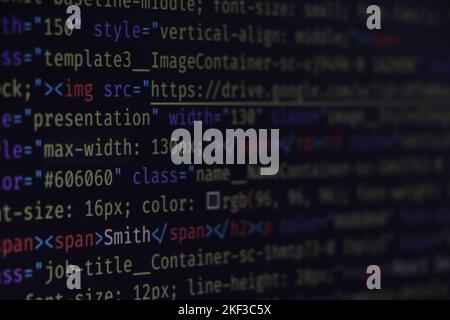 website HTML code in browser view on blue background. Software developer programming code. Stock Photo