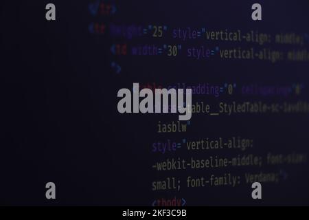 website HTML code in browser view on blue background. Software developer programming code. Stock Photo