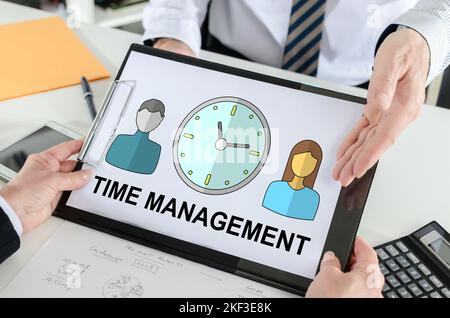 Time management concept shown by a businessman Stock Photo