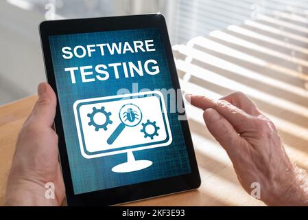 Tablet screen displaying a software testing concept Stock Photo