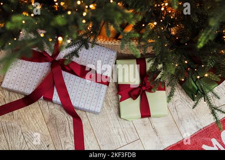Christmas tree with lights full of gift boxes, view from above. Top view Stock Photo