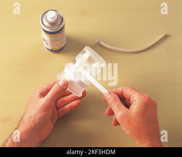 Wrapping a piece of paper around a glass Stock Photo