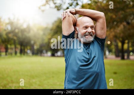 Stretching, fitness and running with old man in park for health, workout or sports with mockup. Warm up, retirement and exercise with senior runner in Stock Photo