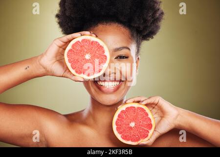 Portrait, black woman and grapefruit for health, skincare and nutrition with smile, happiness and beauty. African, model and wellness woman with