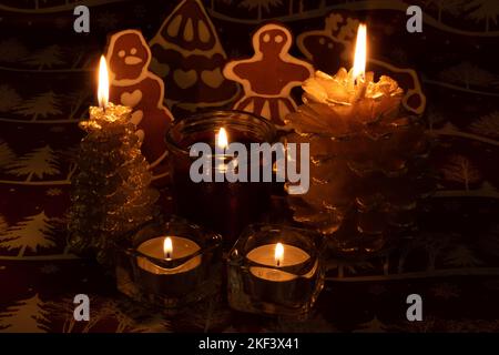 photo burning candles and gingerbread from ikea in the background Stock Photo