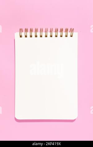 Blank white paper notebook Isolated on pink background. Template mock up Stock Photo