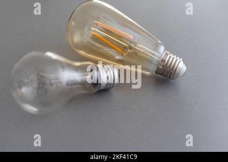 Power energy saving concept. light bulb with light on on gray background. Stock Photo