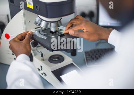 A university student using a microscope Stock Photo