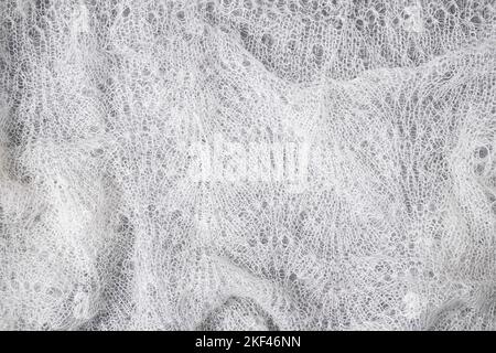 Knitted woolen lace texture background. with vignette. Abstract background with copy space for design. Stock Photo