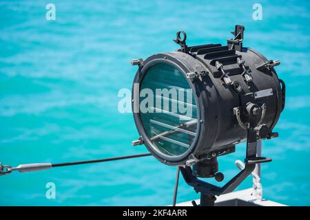 A searchlight or spotlight onboard the navy warship. Stock Photo