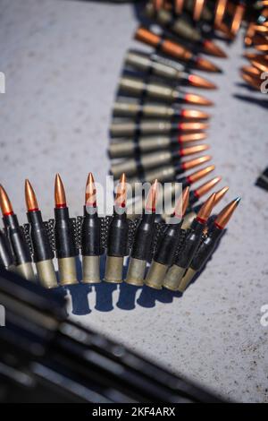 Close up shot of a machine gun belt loaded with cartridges. Stock Photo