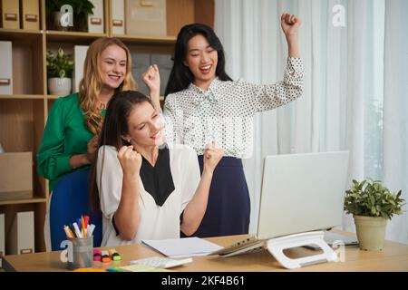 Business team celebrating success of their business project Stock Photo