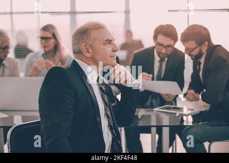 close up. pensive businessman sitting in the office. Stock Photo