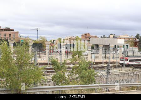 Train. Train tracks. Train entering a station. Subway leaving the station. Means of transport in Madrid, in Spain. Horizontal photography. Stock Photo