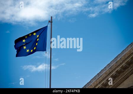 A low angle shot of the European union flag on display near the Teatro Massimo in Palermo in Italy Stock Photo