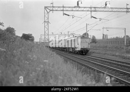 original british rail electric locomotive class 87 number 87025 borderer on passenger service near rugby late 1970s early 1980s Stock Photo