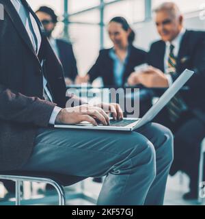 close up. businessman using a laptop in the workplace. Stock Photo