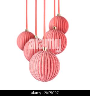 Set of pink Christmas ornaments hanging over white background. Christmas tree decorations isolated on white Stock Photo