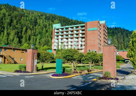 Sand shore of the lake leading to resort building Stock Photo