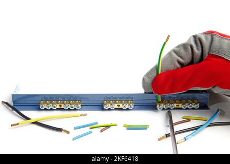 Installation electrical wire with terminal block. Electrician in Stock Photo