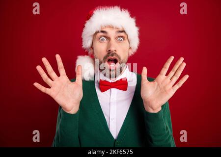 Photo of impressed frightened person open mouth raise opened arms palms isolated on red color background Stock Photo