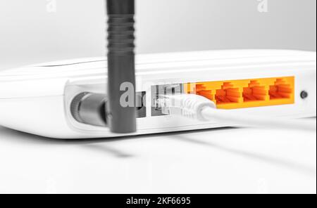 White Wi-Fi router for connecting devices to the Internet. Stock Photo