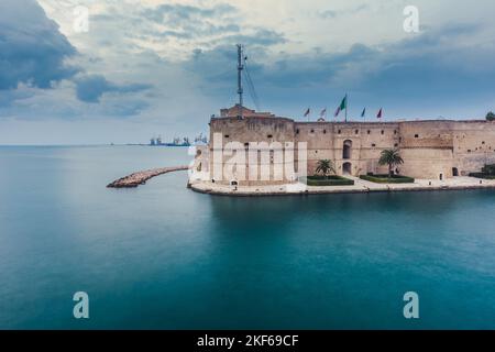 Aragonese Castle of Taranto and revolving bridge on the channel between Big and Small sea. Puglia, Italy. Stock Photo