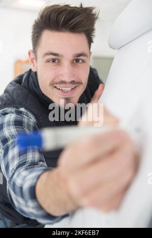 man writing on task board in office Stock Photo
