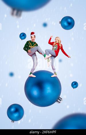 Vertical collage image of two overjoyed cool people dancing have fun huge tree toy ball isolated on creative background Stock Photo