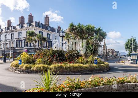 Floral roundabout and clock in the centre of the Victorian seaside resort of Llandudno, North Wales, UK. Stock Photo