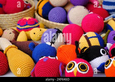 Colorful handmade knitted dolls showcase at the fair in Pune, India. Stock Photo