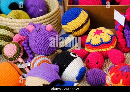 Colorful handmade knitted dolls showcase at the fair in Pune, India. Stock Photo