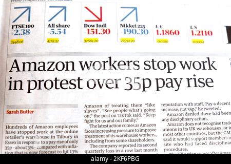 'Amazon workers stop work in protest over 35p pay rise' Guardian newspaper headline Financial section article 5 August 2022 London England UK Stock Photo