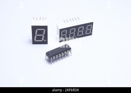 Integrated circuit SN74HC595N or 74595 with 2 7-segment modules and on a white background. Stock Photo